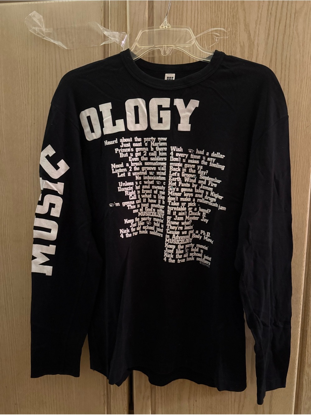 Musicology Long Sleeve Tee  with song titles from concert of same name written.